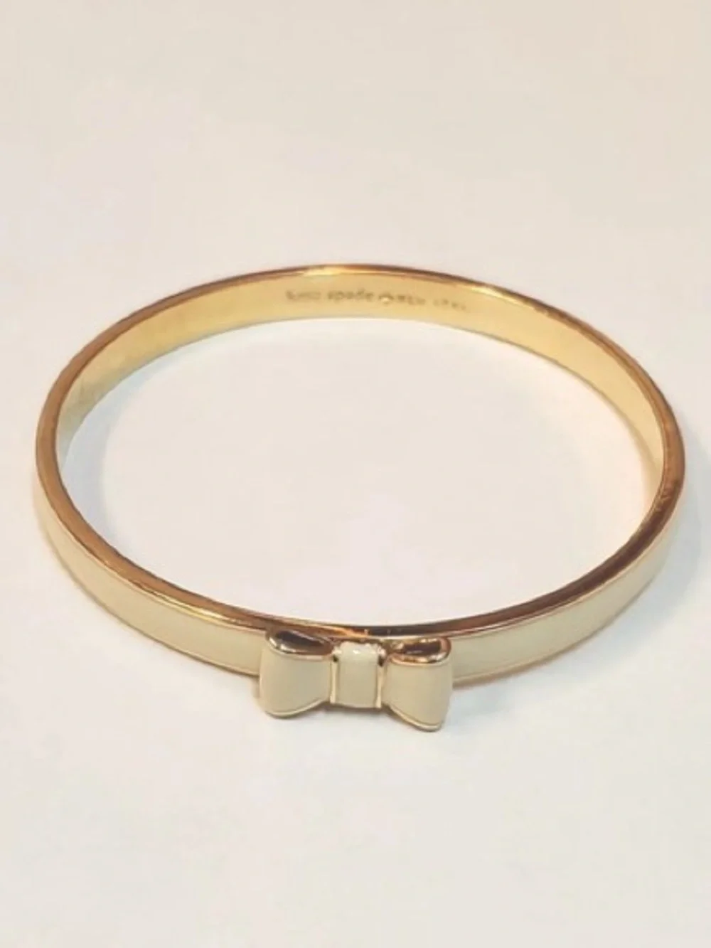 Kate Spade New York Take A Bow Bangle Bracelet Gold White Enamel - Picture 2 of 6